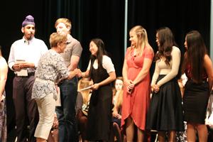 Assistance League member presents scholarships to seniors 
